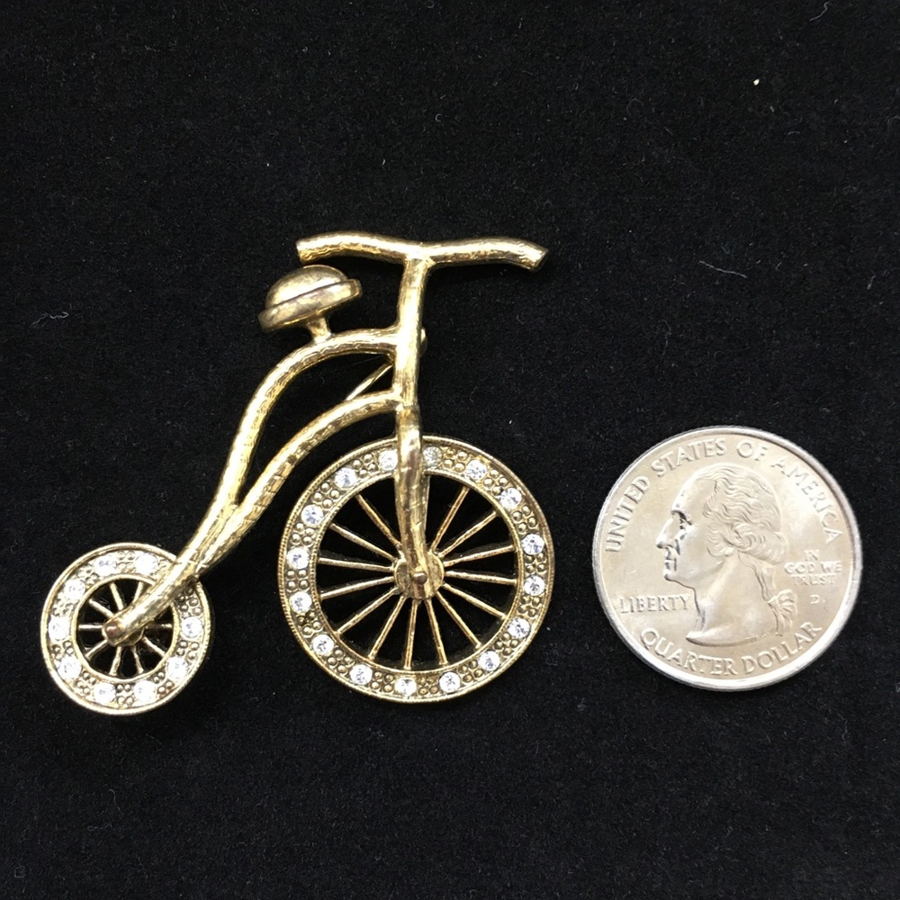 Gold tone bicycle brooch with rhinestones
